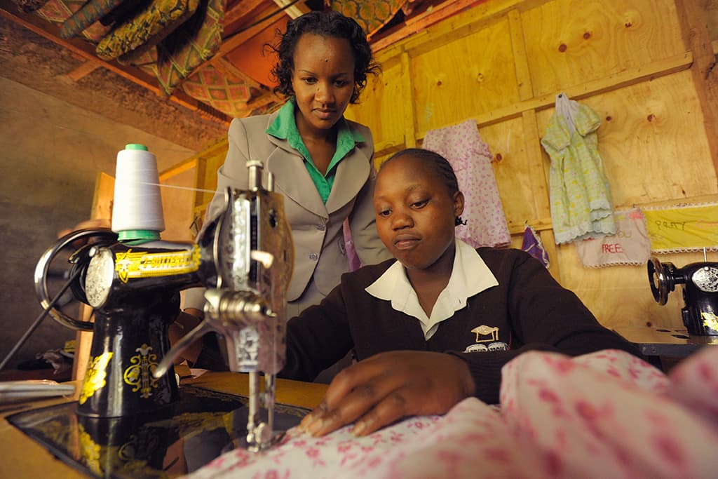 A girl using a sewing machine