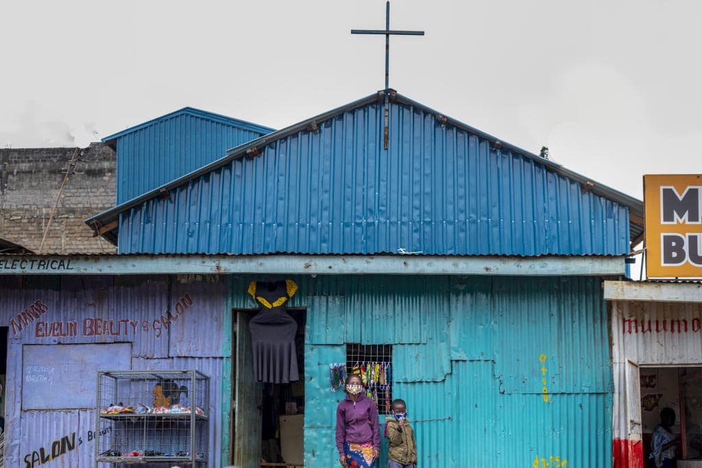Noreen stands with her mother in Kenya