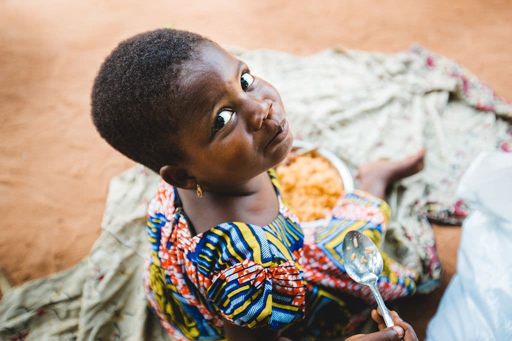 Girl looking back with plate