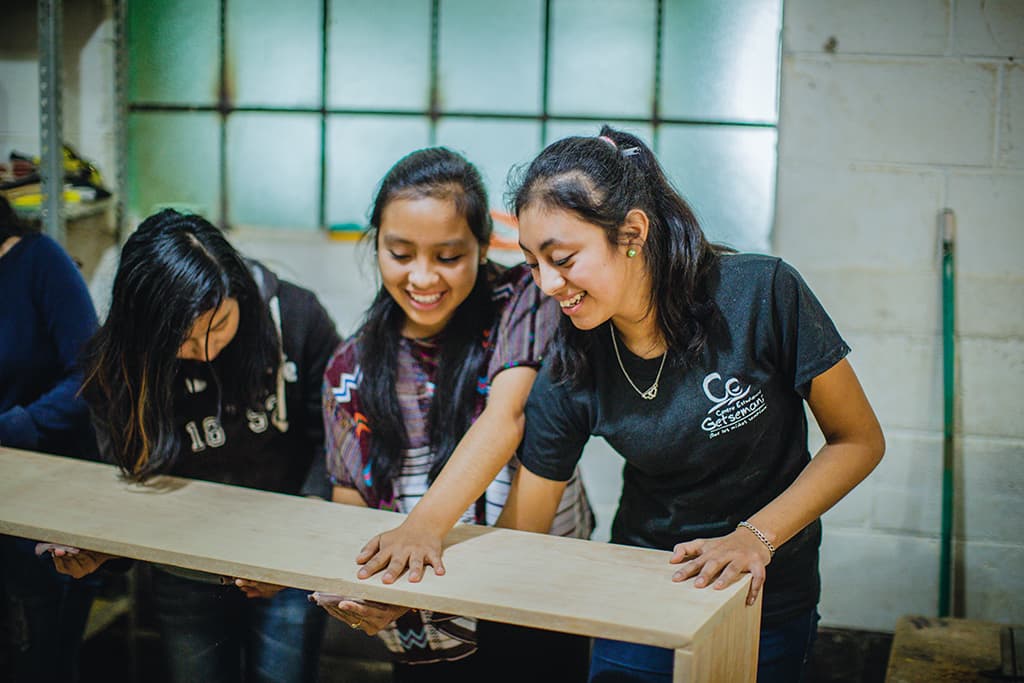 Girls learning carpentry
