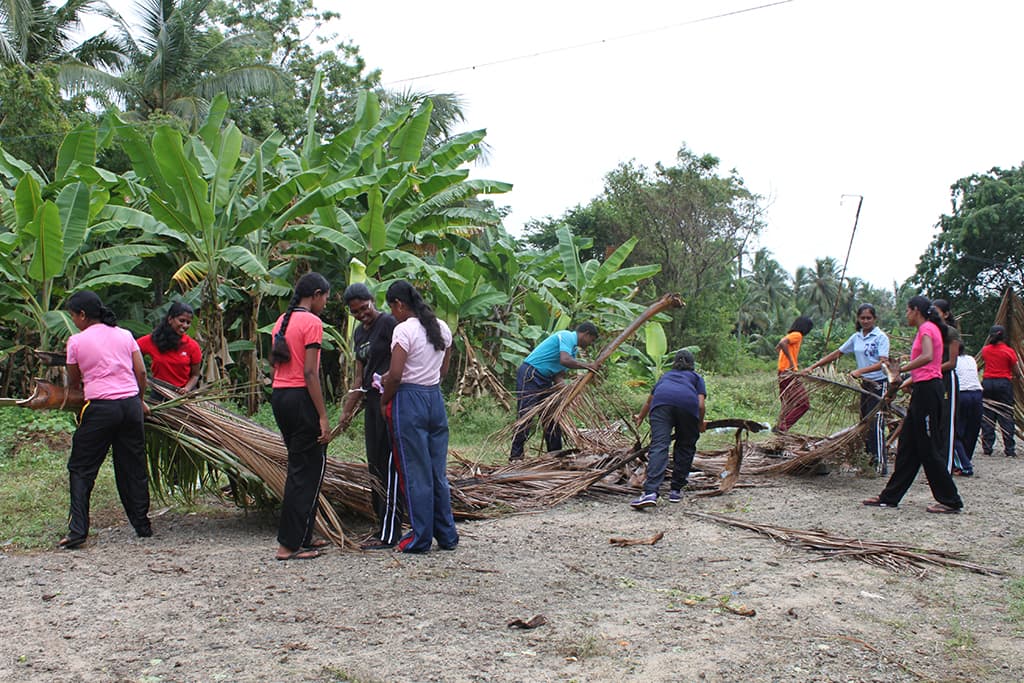 Children cleaning their community
