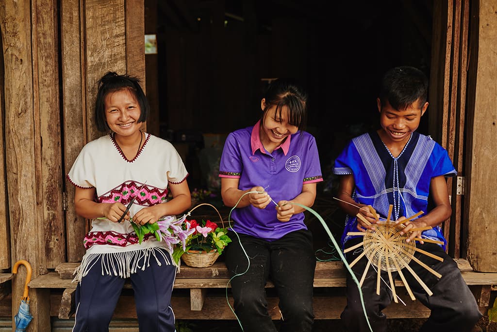 young people weaving baskets
