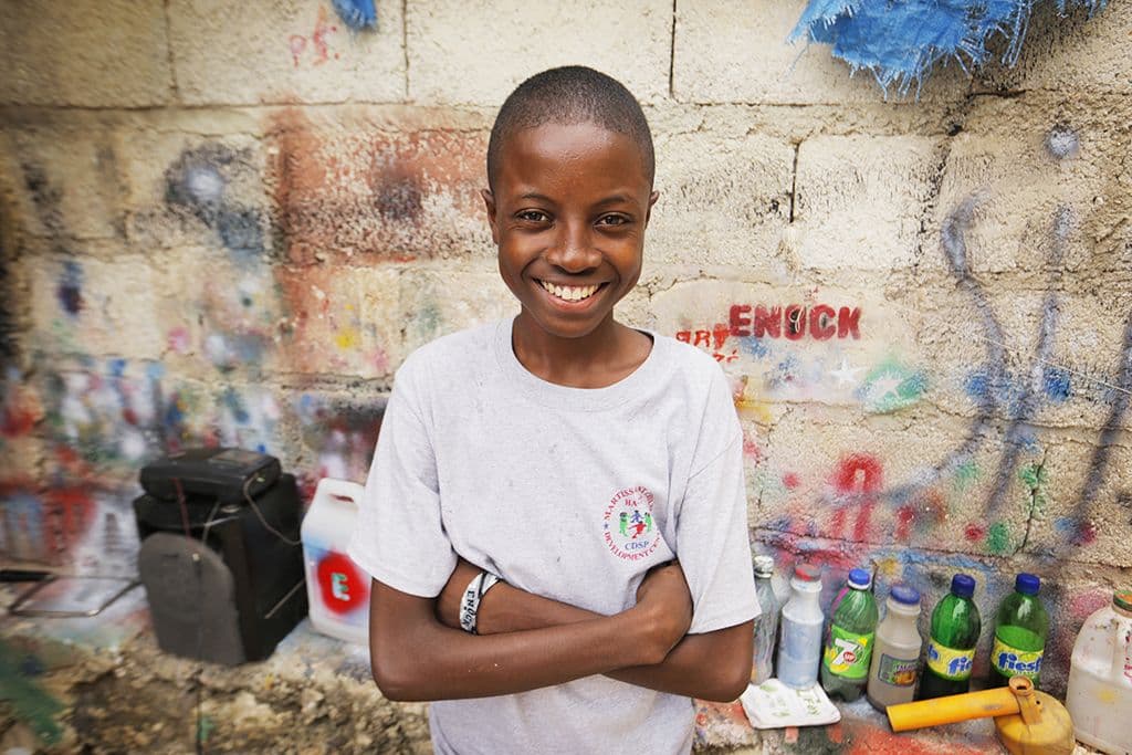 boy smiling with paints