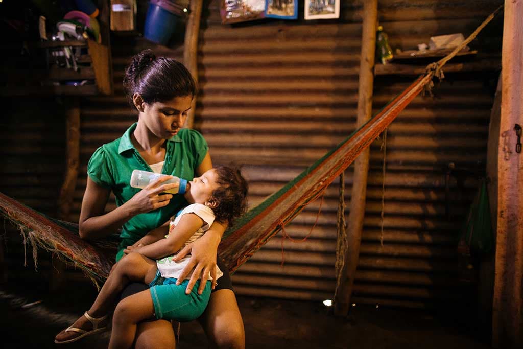 Cindy feeding her baby
