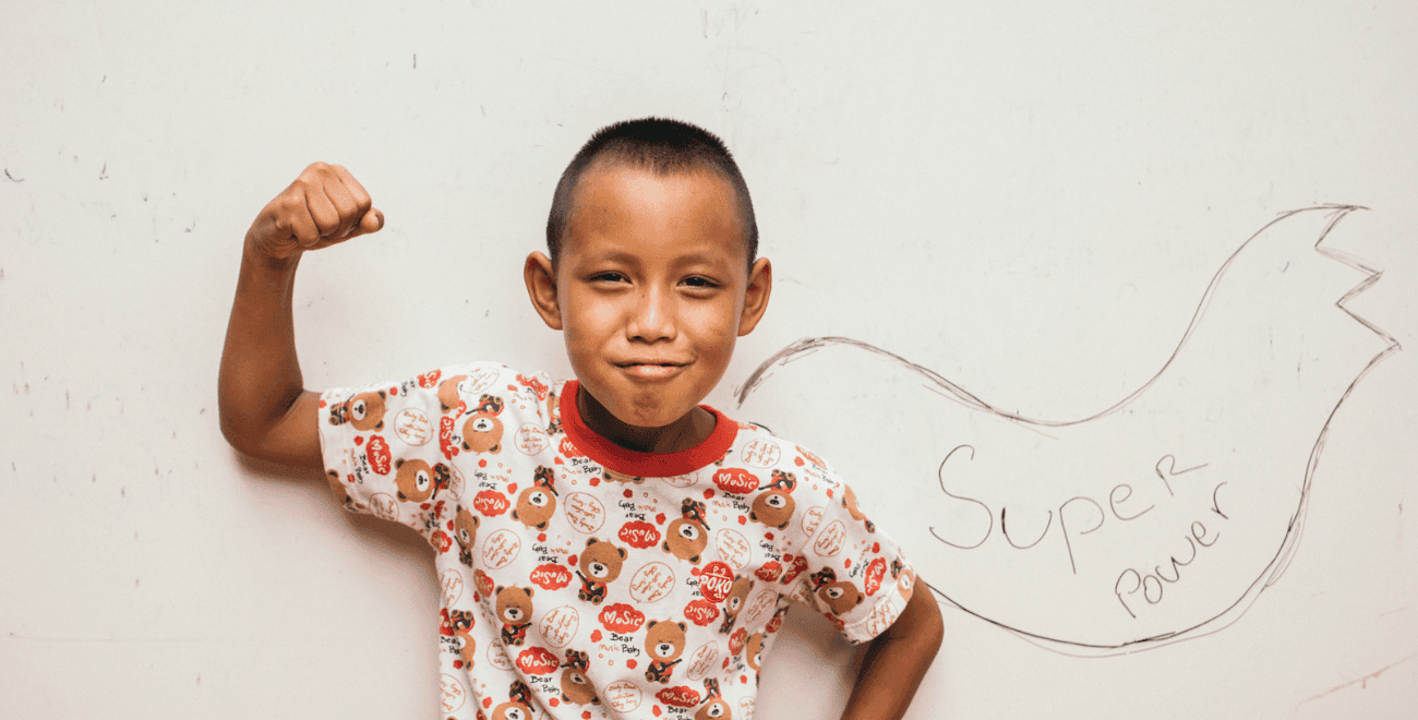 Boy flexes his strength