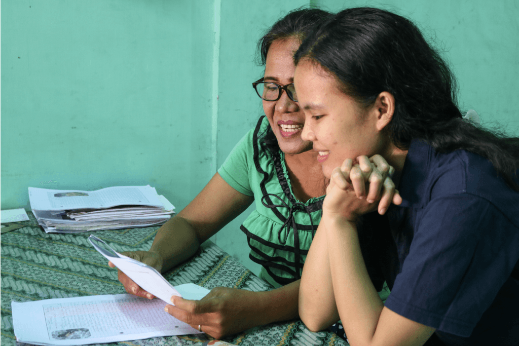 Ani and her mother read a letter together