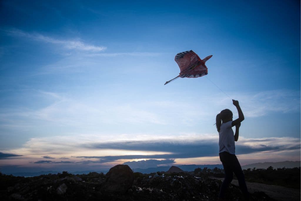 Girl flying a kite