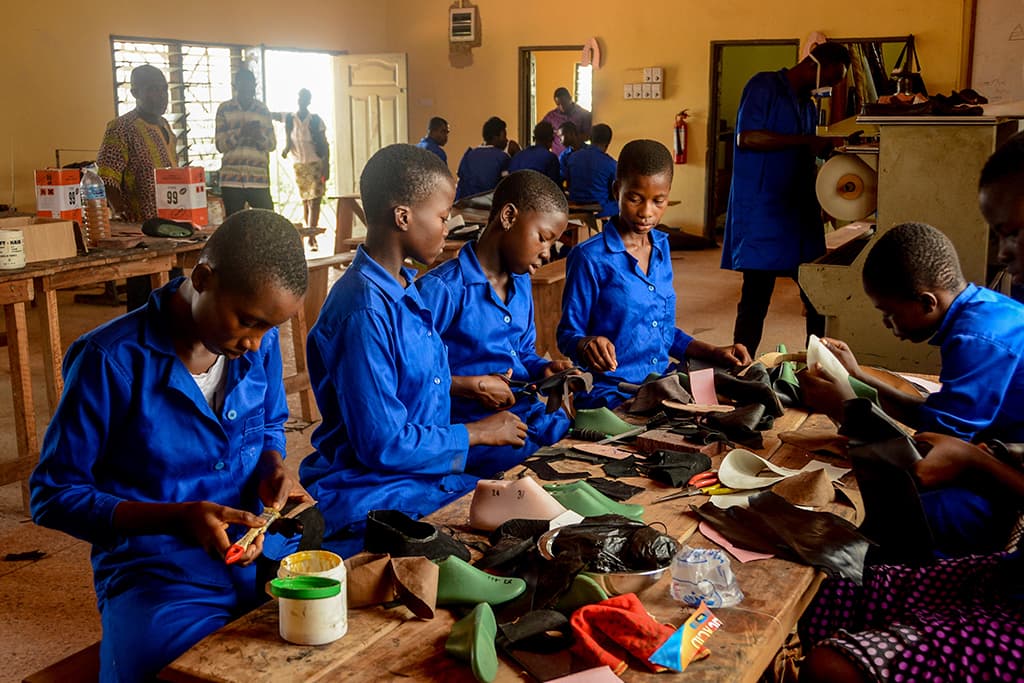 Children making shoes