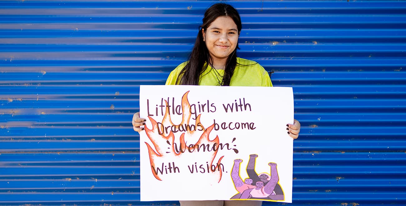 Annet holding a banner
